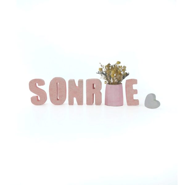 Sonrie en Concreto Rosa